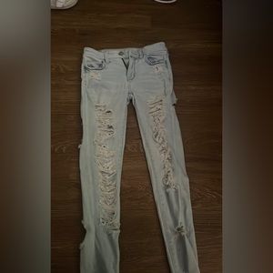 American eagle skinny jeans, they’re distressed, and mid waisted